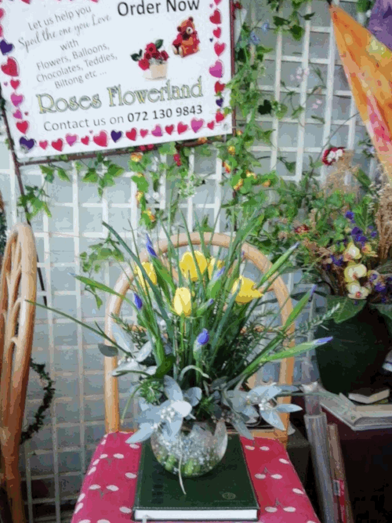 Glass bowl with irises and roses from R700 when in season Glass bowl with irises and roses from R700 when in season